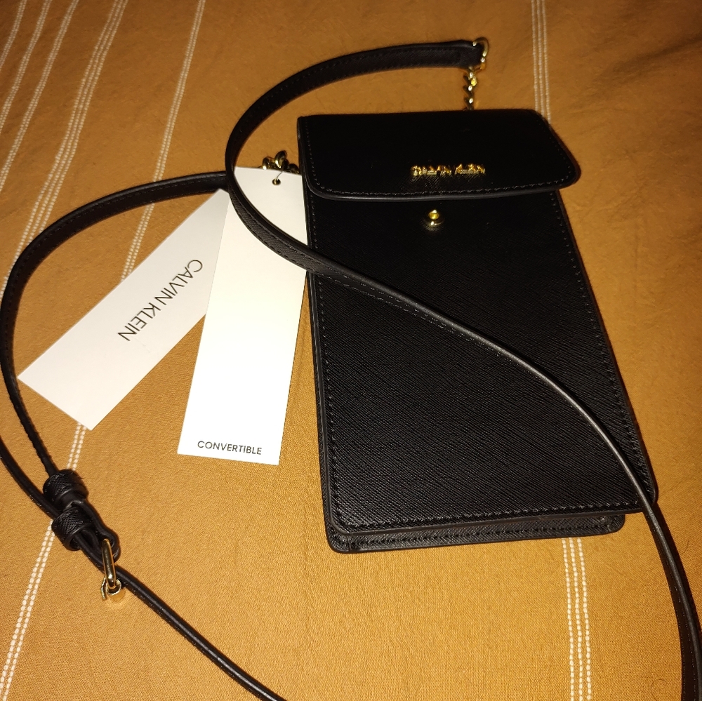 Cross body phone wallet with credit card holder.